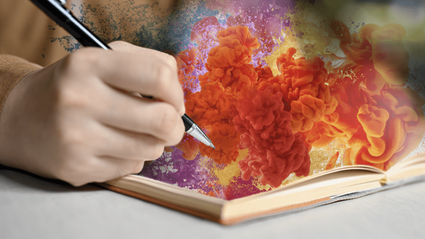 Hand holding pen writing in notebook with colorful smoke rising from the paper