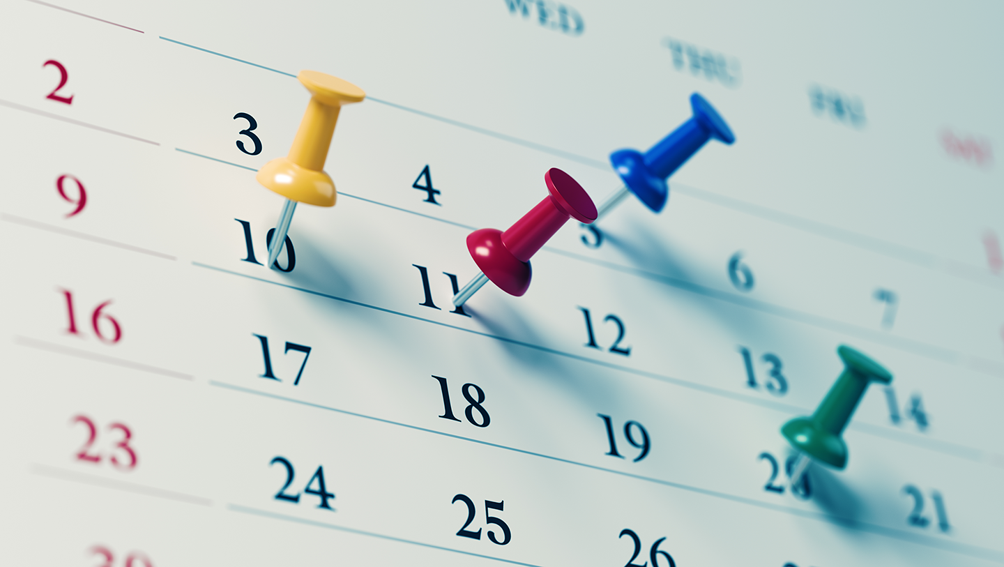Dates on a calendar with pins in them