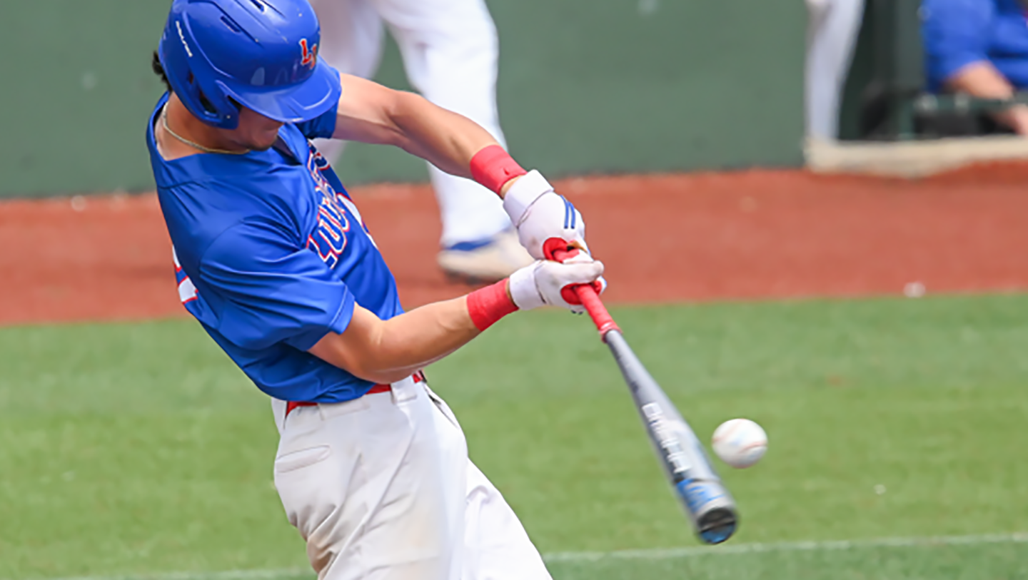 An LLCC baseball player hits a baseball