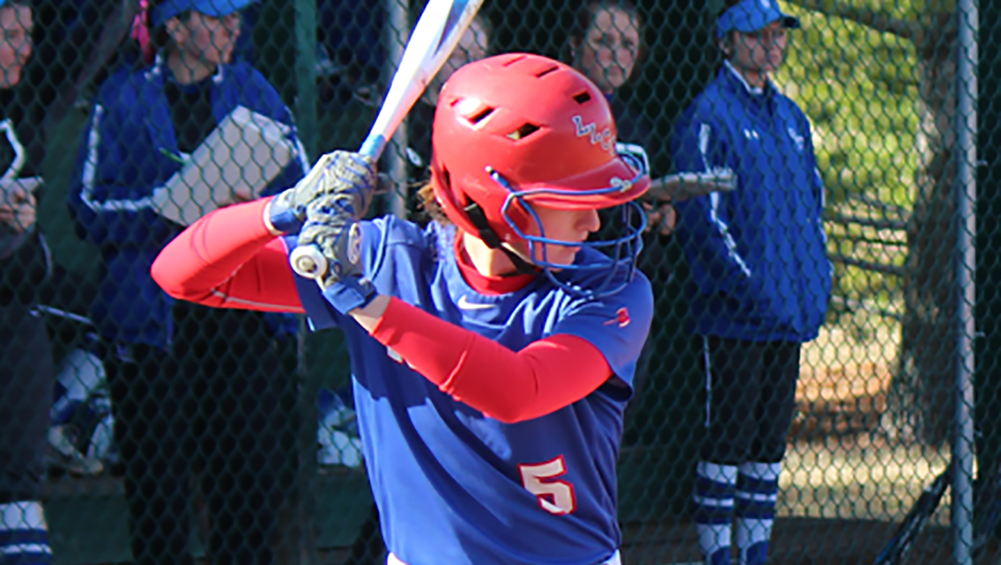 LLCC softball player prepares to hit a ball