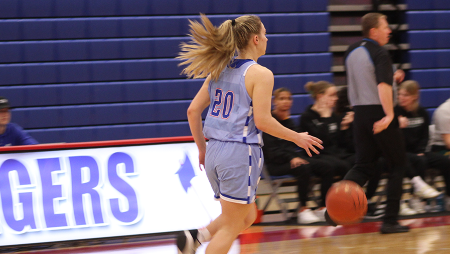 female basketball player dribbling ball