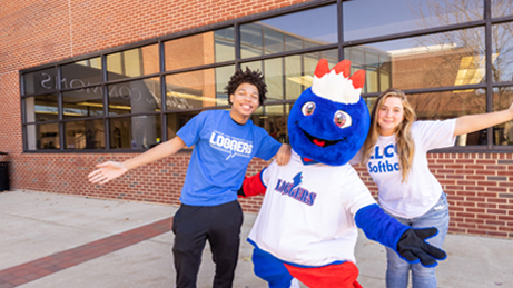 two students with Linc, the LLCC mascot