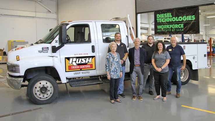 LLCC staff and Rush Truck Centers representatives pose for a photo in front of a GMC 550 truck donated by Rush.