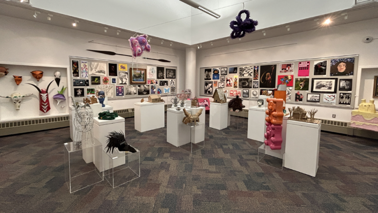 An art gallery filled with colorful works created by students.