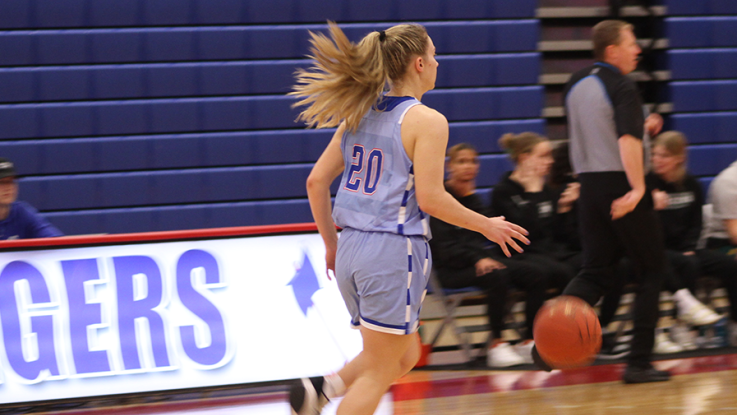 female basketball player dribbling ball