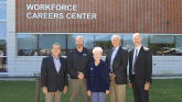Don Schaefer, Dan Smith, Dr. Charlotte Warren, Ken Elmore and Christopher McDowell, M.D in front of LLCC's Workforce Careers Center