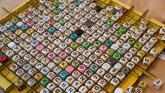 Many boggle letter dice on table
