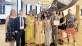 PTK students pose near a staircase