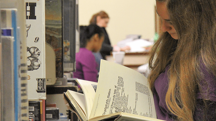 student holding a paper