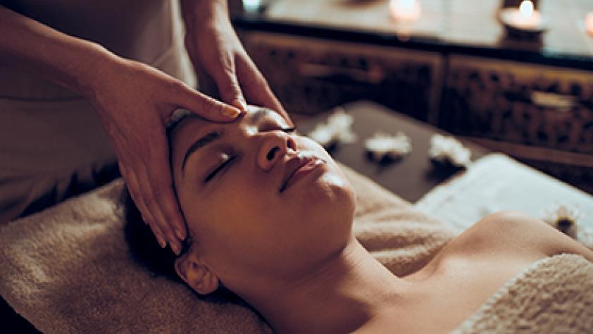 Women having forehead massaged