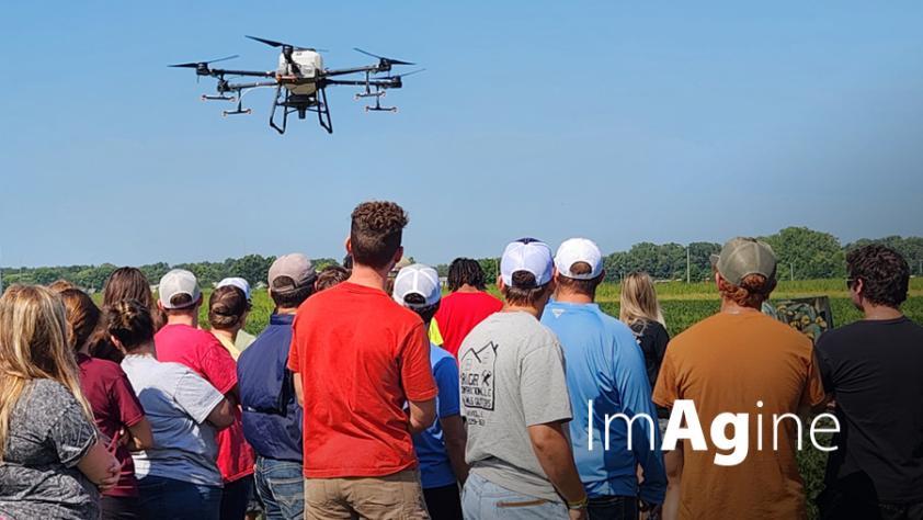 Imagine - LLCC Ag students watching the Ag drone flying overhead.