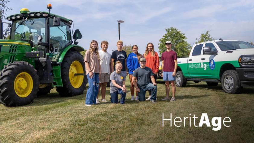 Heritage - LLCC Ag students pose outside of Kreher Ag Center in front of a tractor and truck.