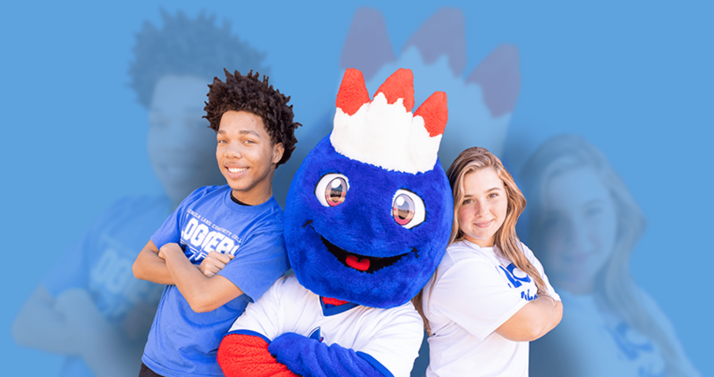 Two students standing with arms folded next to the LLCC mascot, Linc.