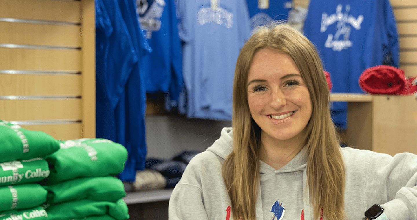 LLCC student smiling in the bookstore.