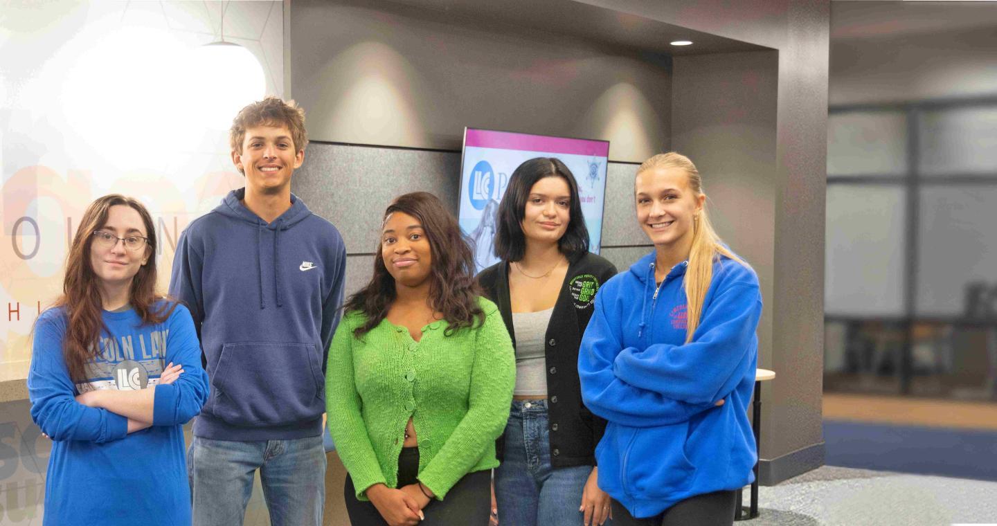 Five students gathered in the LLCC Student Services Hub