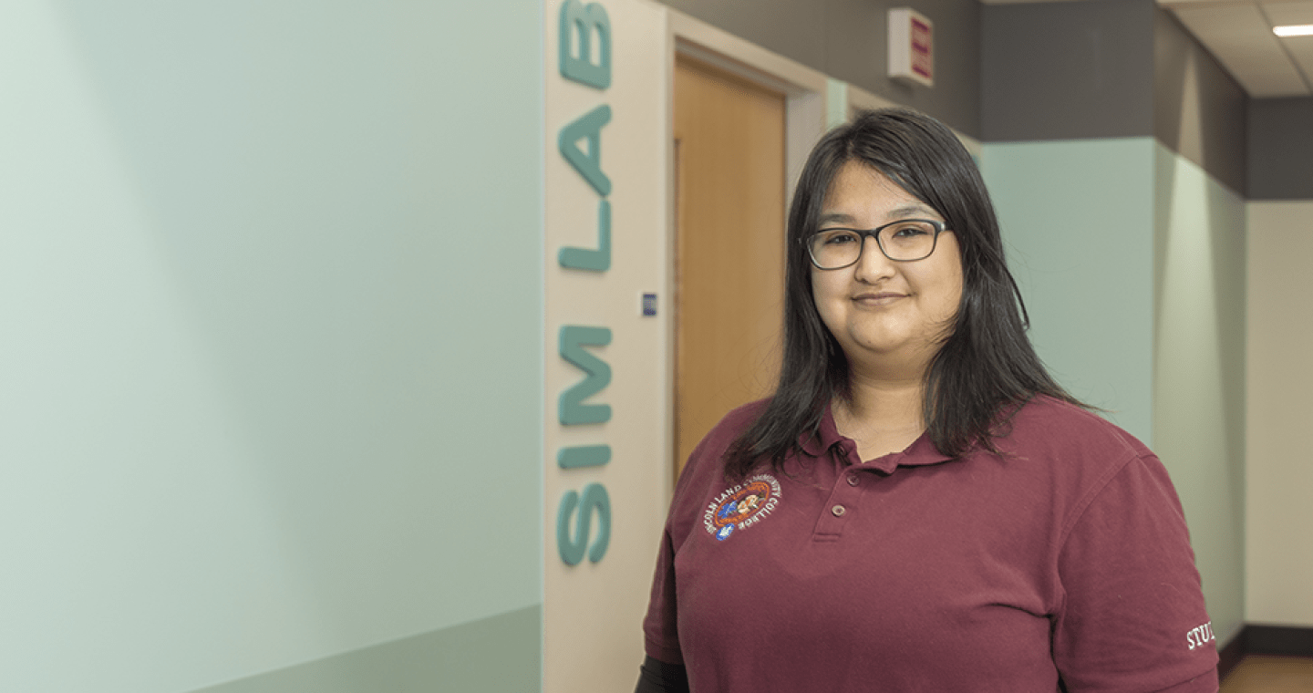 EMS student near a SIM lab  hallway