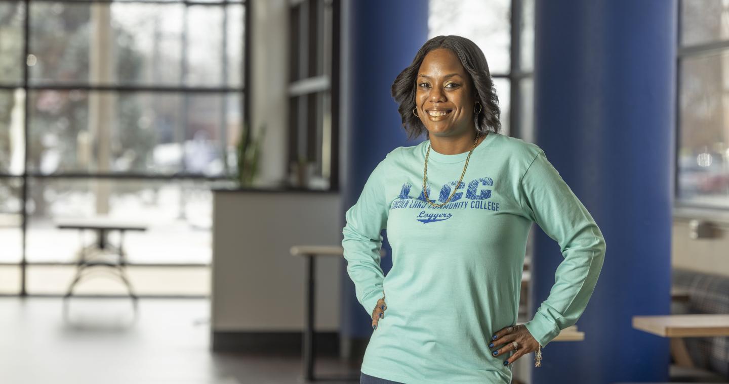 Female LLCC health care student in the Menard Atrium.