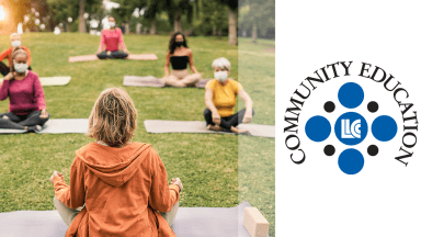 LLCC Community Education. Picture of a yoga class taking place in a grassy area.