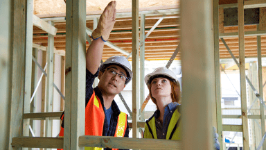 Employer and student on construction site