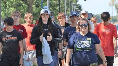 LLCC recruiter leading high school student group on a tour.