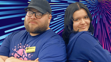 Two students smiling.