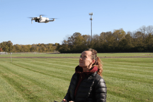 man holding controls of a drone