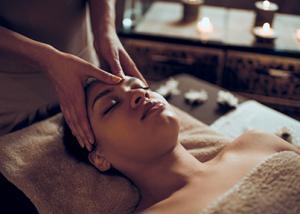 Woman having forehead massaged