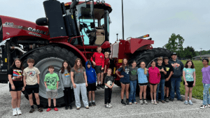 “Ag Explorers” campers in front of a tractor provided by Beard Implement