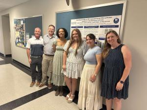 Students and faculty during a poster presentation