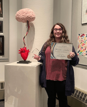 Miranda Sanders with her art award.