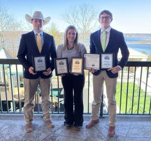 three LLCC students pose with their awards