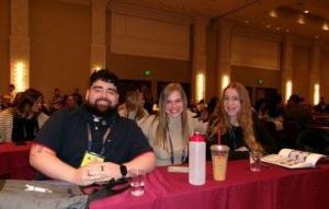 three students at a national conference