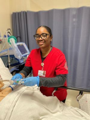Respiratory student handling equipment