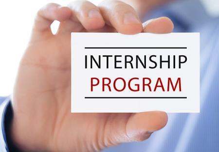close up of hand holding a card that says "Internship Program"