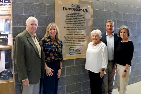 Roland Machinery - owner/employee standing in front of LLCC diesel program classroom