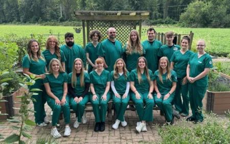 Radiography students pose for a group photo in their scrubs