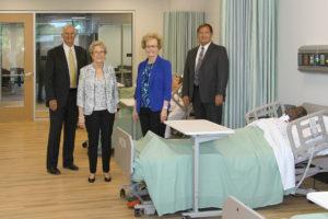 Ken Elmore, Dr. Charlotte Warren, Marsha Prater and Ed Curtis discuss state-of-the-art features in a nursing lab of the new LLCC Nursing Education Center
