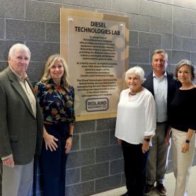 Roland Machinery - employees/owners standing in front of the LLCC diesel classroom